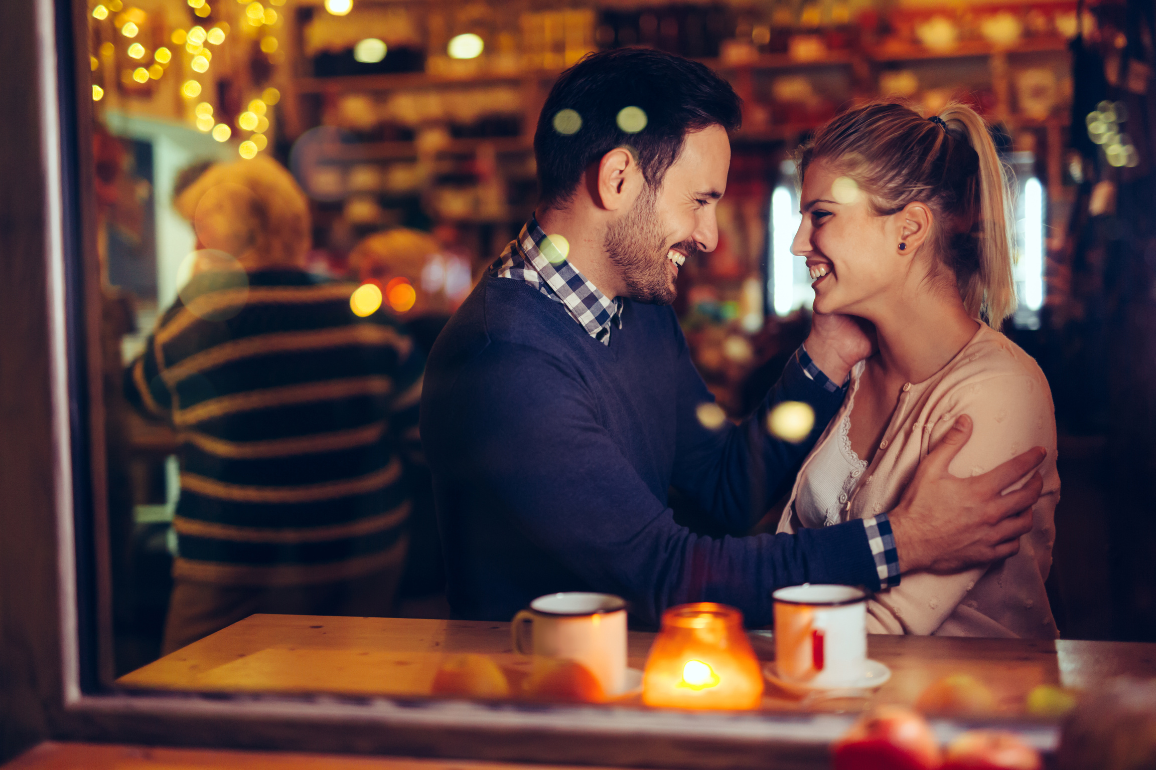 Romantic couple dating in pub at night
